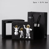 a black box with two small figuris in it