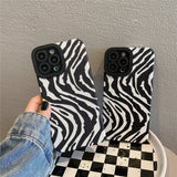 a pair of zebra print iphone cases