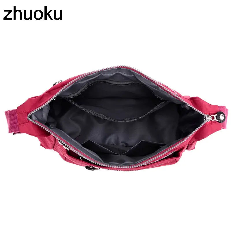 a pink bag with zippers and zippers