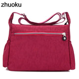 a red handbag with zippers and zippers