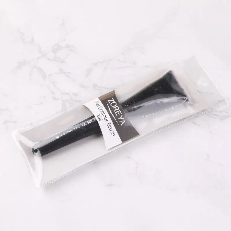 the brush is in a clear bag on a marble surface